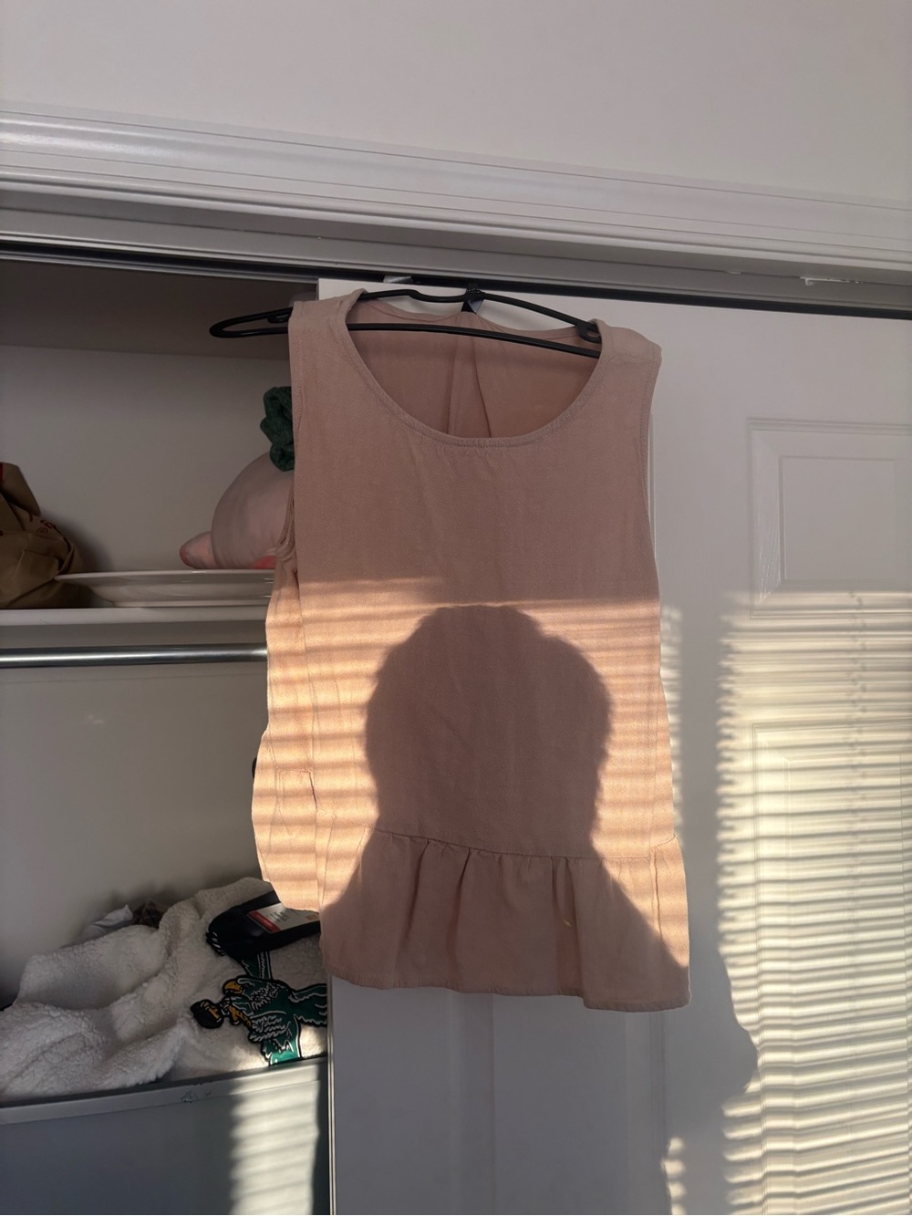 Sleeveless Peplum Shell Top in Blush Pink